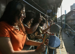 Indian women bang pots in support of Emergency Services