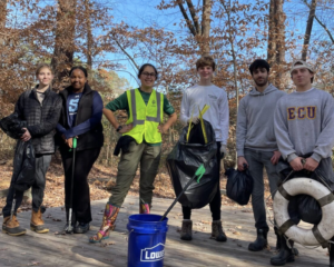 Youth group engaged in stream clean up at House Creek Tributary in Raleigh